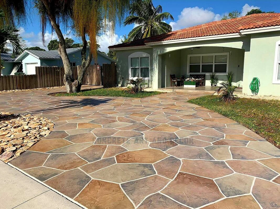 Custom stamped concrete in Dallas TX featuring natural flagstone pattern with earth-tone color variation for Mediterranean-style home.